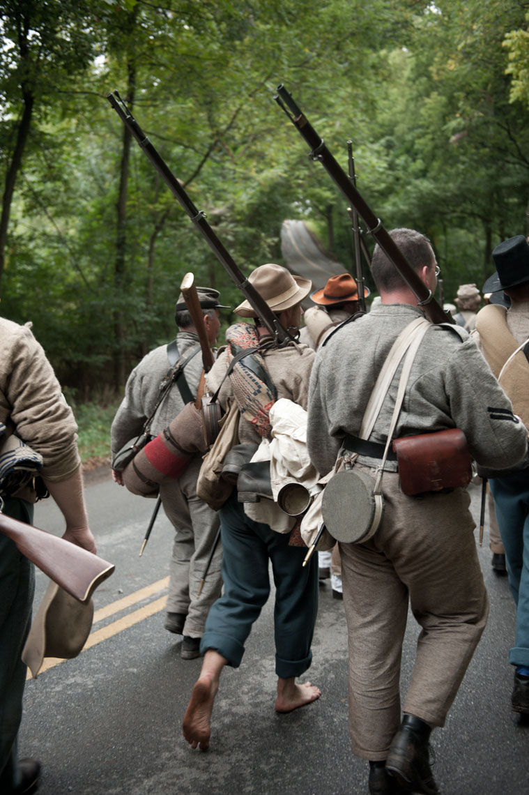 Civil War reenactors at Antietam: a barefoot reenactor marches without shoes