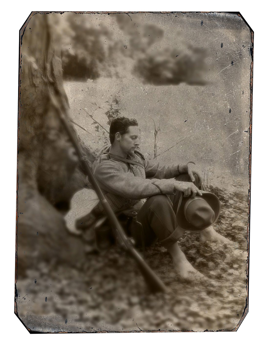Civil War reenactors at Antietam: black and white photo of reenactor Clint Cardinale resting under a tree