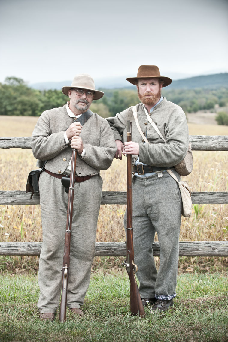 Civil War reenactors at Antietam: Father and son reenactors James and Jason Tinney pose for the camera