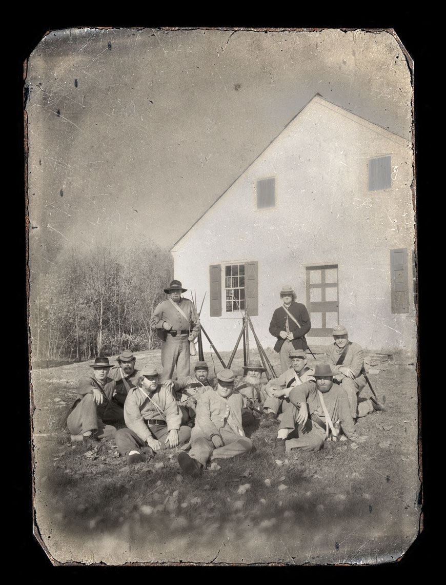 Civil War reenactors at Antietam: a black and white group photo of reenactors in front of Dunker Church