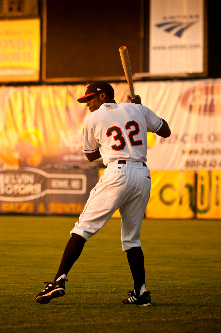 Bowie Baysox takes player Keith Reed takes pregame swings in the outfield