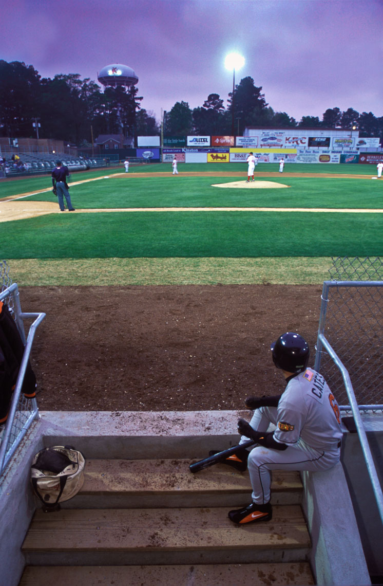 Gary Cates watches from the dugout during a Frederick Keys v. Kinston Indians game