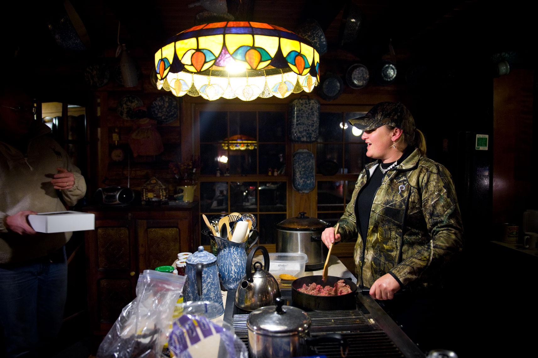 Hunting for waterfowl on the Eastern Shore of Maryland: a hunter cooks meat in the kitchen, captured from the day
