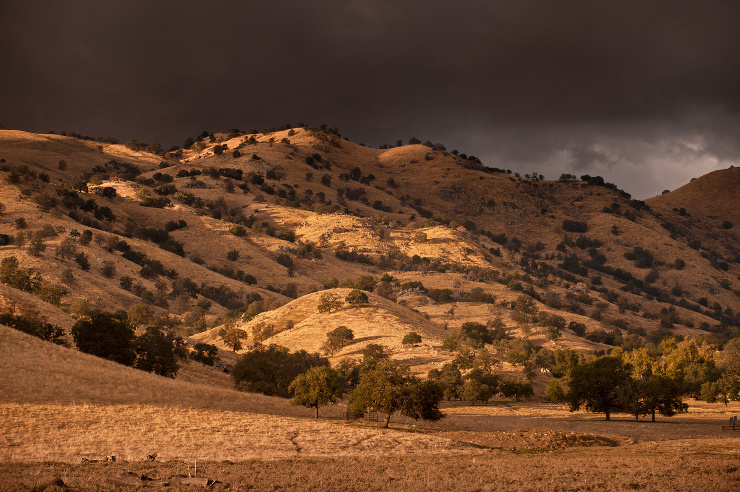Sunset grazes the hills of the Yokohl Valley as a storm sweeps in off the mountains