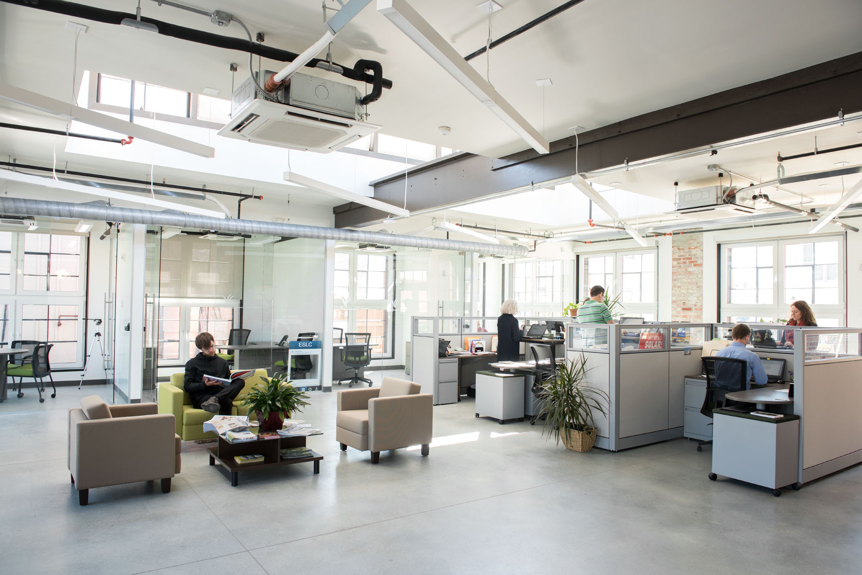 People at work in a modern open-air office environment
