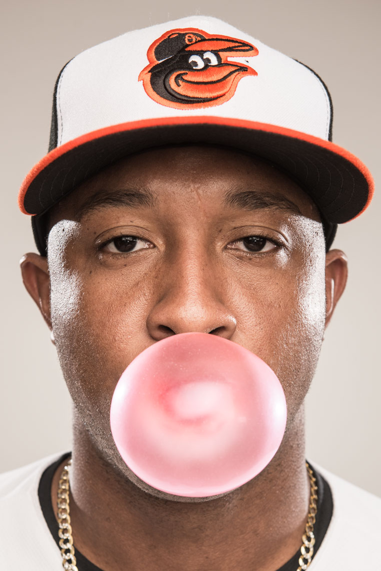 Baseball player Jonathan Schoop Boeing a large pink bubble
