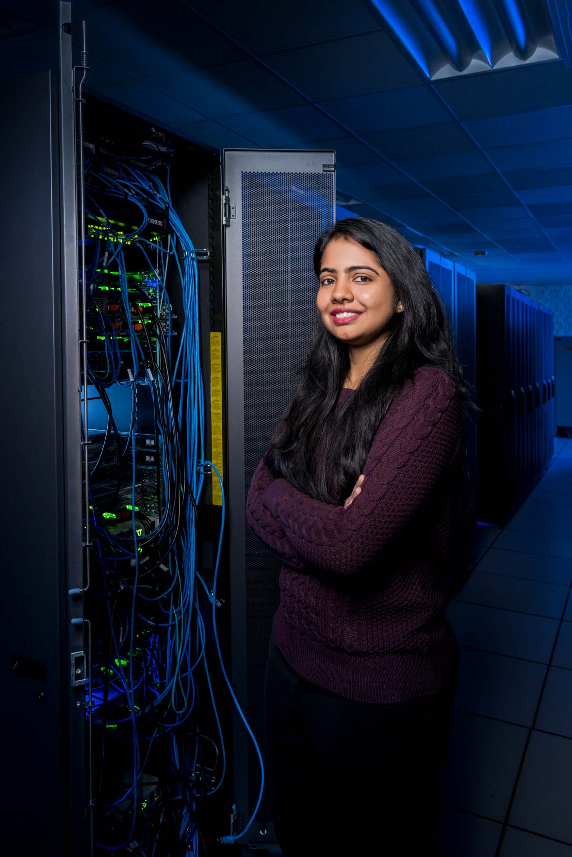Cyber security student standing in the A.V. Williams Server Room