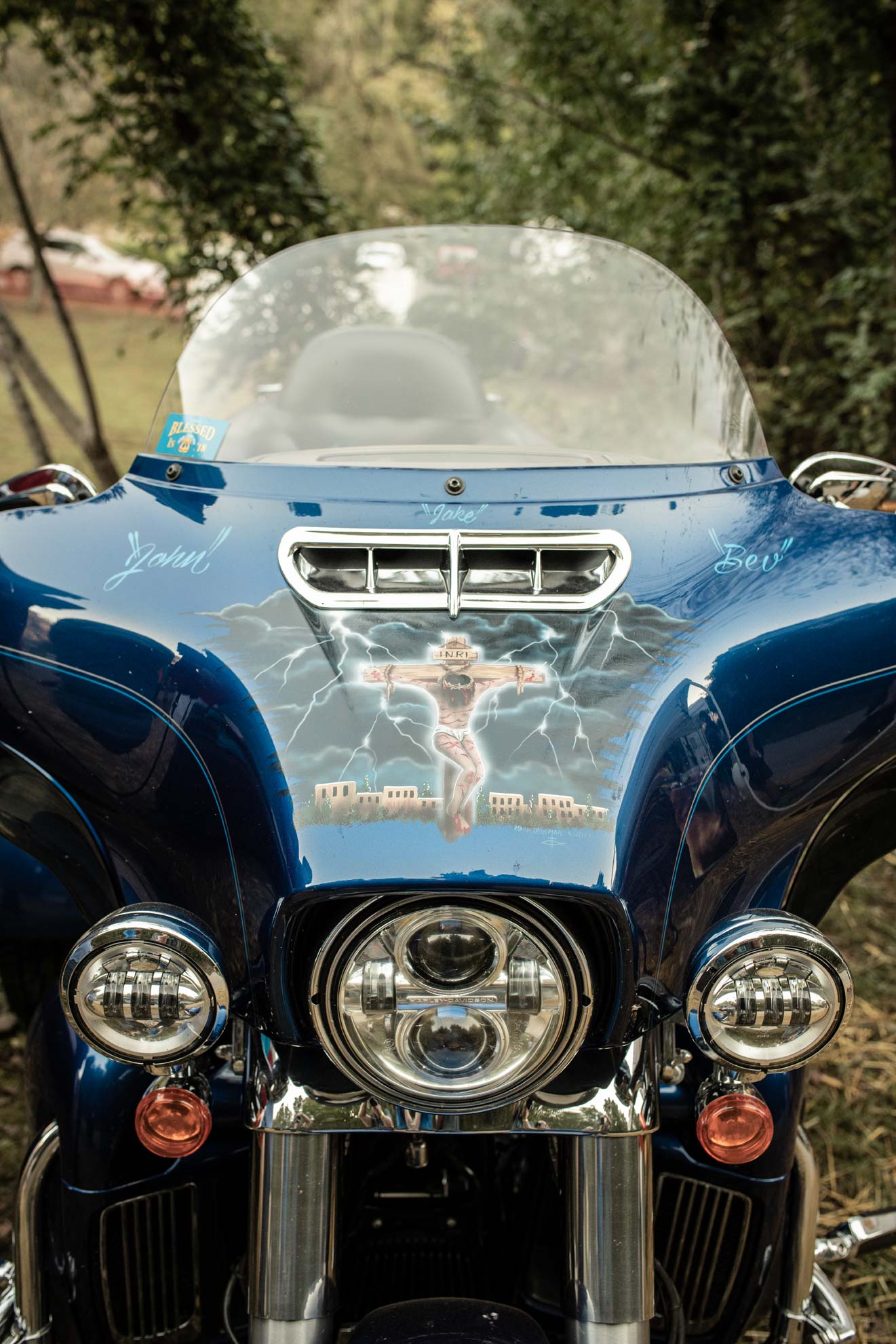 National Trailfest: A motorcycle painted with the name John, Jake, Bev, and a picture of the crucifixion