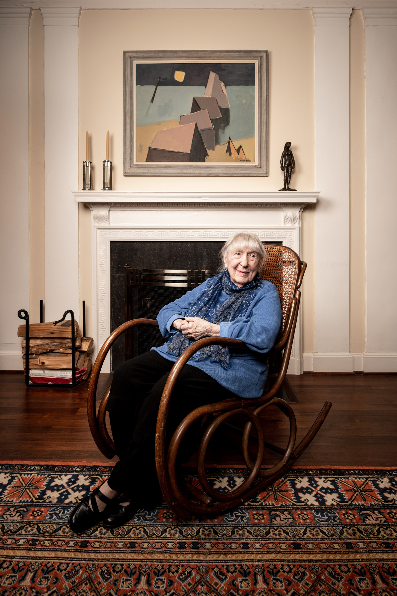 Lois Feinblatt seated in a rocking chair in her Baltimore home