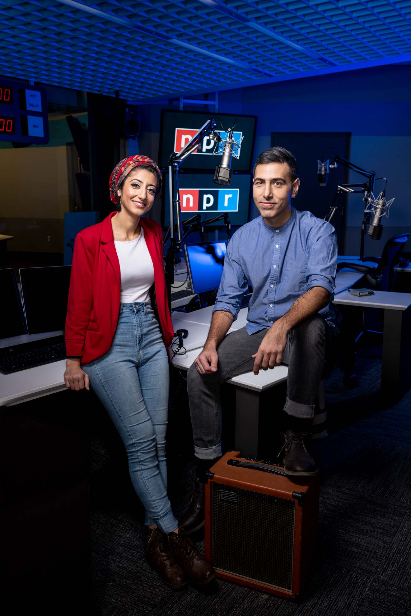 Rund Abdelfatah and Ramtin Arablouei in a radio recording studio with a blue background at NPR